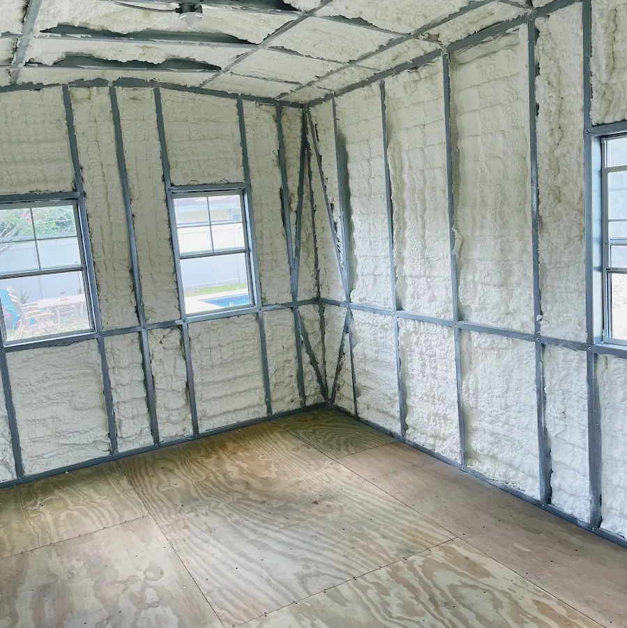Closed-cell spray foam insulation applied to wall cavities in a residential project in Hamlin